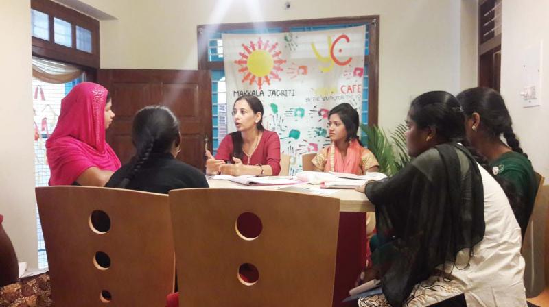 Members of the Makkala Jagriti Holistic Development Learning  Centres talking to students  (Photo: DC)