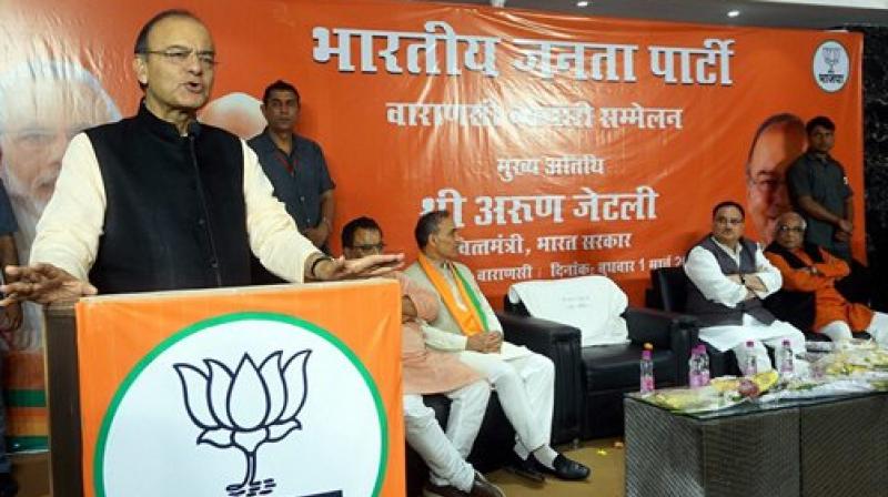 Union Finance Minister and BJP leader Arun Jaitley addresses the party Traders Meet in Varanasi on Wednesday. (Photo: PTI)