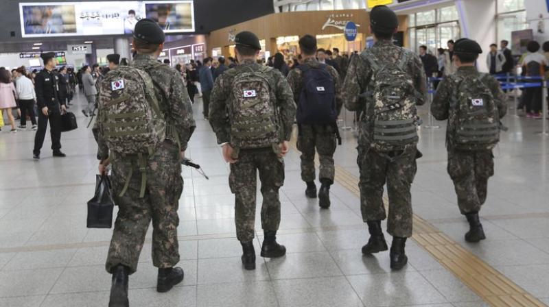 A watchdog group says South Koreas army is hunting down and prosecuting gay servicemen after a video of two male soldiers having sex was posted on the internet earlier this year, stoking fear in an already persecuted minority group. (Photo: AP)