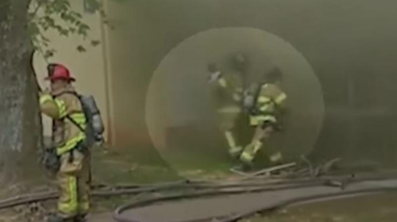 US firefighter catches baby thrown out from burning building