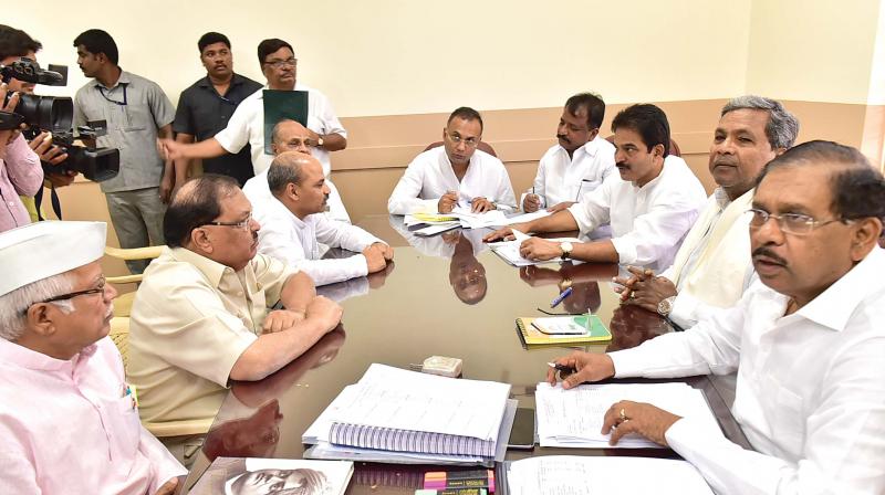 KPCC president Dr G Parameshwar, CM Siddaramaiah, AICC general secretary in-charge of state K.C. Venugopal and other leaders at PCC meeting in Bengaluru on Tuesday 	(Photo:DC)