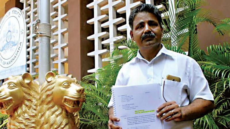 KAS officer K. Mathai after filing a complaint against four IAS officers at Lokayukta office, in Bengaluru on Wednesday. (Photo:DC)