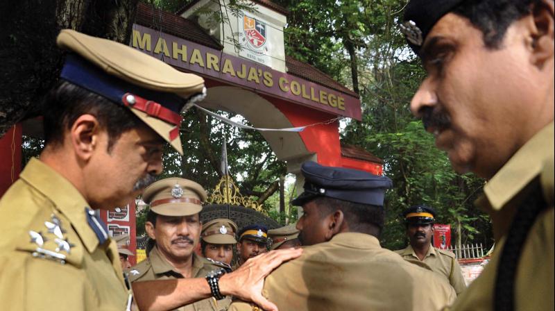 City police commissioner M.P. Dinesh examines a policeman who came under attack during a clash between two groups of students at Maharajas College in Kochi on Friday.  (Photo: SUNOJ NINAN MATHEW)