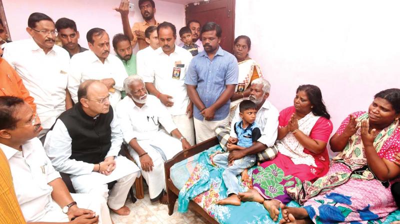 Union finance minister Arun Jaitley visits slain RSS leader S.L. Rajeshs home at Sreekariyam in Thiruvananthapuram on Sunday along with BJP state president Kummanam Rajasekharan and former president V. Muraleedharan. (Photo: DC)