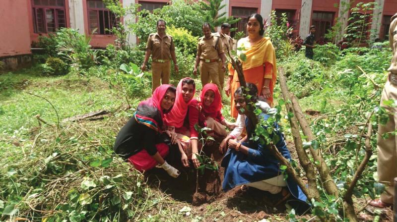 NSS volunteers of Government Arts and Science College working with the fire and safety department officials  during a cleaning drive.  	FILE