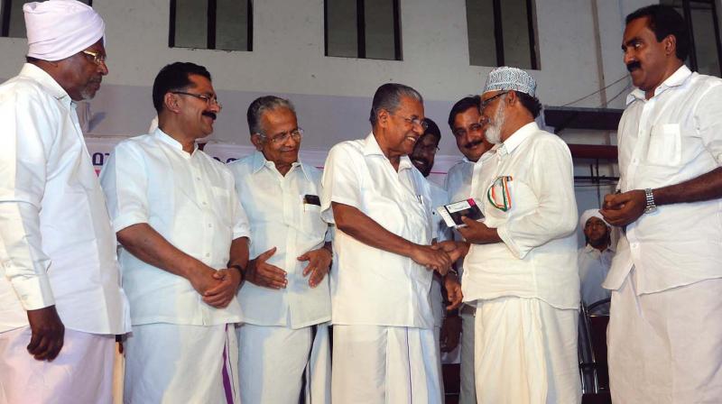 Chief Minister Pinarayi Vijayan inaugurates the distribution of travel documents for Haj pilgrims from the state at Nedumbassery airport on Saturday.