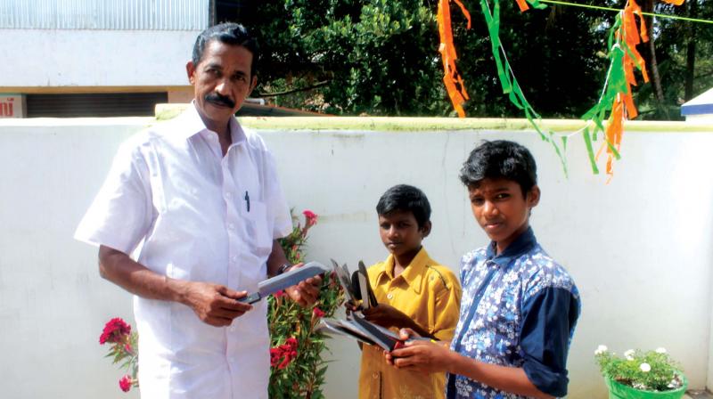 Mahesh (extreme right) and Sumesh sell curry knives at Punnapra on Independence Day.