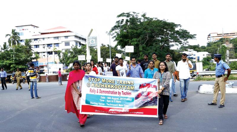 Techies at Technopark take out a march to Kazhakkoottam railway station on Friday demanding stoppage for more trains. (Photo: DC)