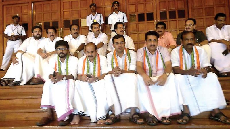 Opposition MLAs stage an indefinite sit-in in front of the Assembly demanding minister K. K. Shylajas resignation on Monday. (Photo: Peethambaran Payyeri)