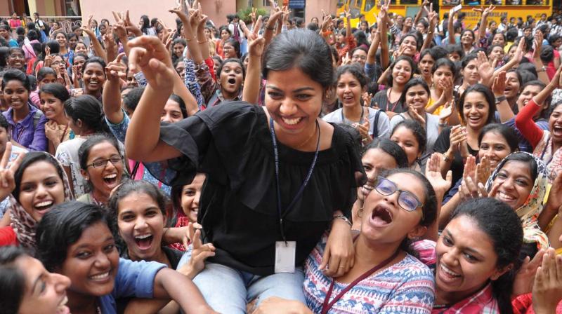 Chairperson-elect Aleena A Vithayathil is lifted by friends after the results were declared in the St. Teresas College in Kochi on Tuesday. (Photo: SUNOJ NINAN MATHEW)