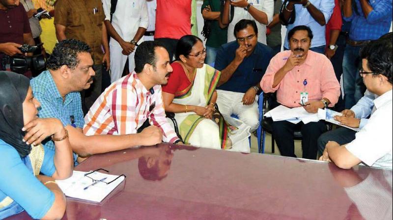 Minister K.K. Shylaja interacts with a team from AIIMS at Thiruvananthapuram Medical college on Tuesday. (Photo: DC)