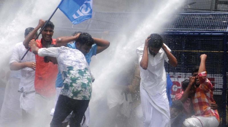 Police use water cannon against KSU workers who were demanding the resignation of Health Minister K. K. Shylaja in front of the Assembly  in Thiruvananthapuram on Thursday. (Photo:  A.V. MUZAFAR)
