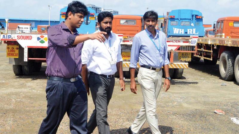 Ernakulam district collector Mohammed Y. Safirulla, visits the container truck parking yard at Vallarpadam on Saturday. 	 DC