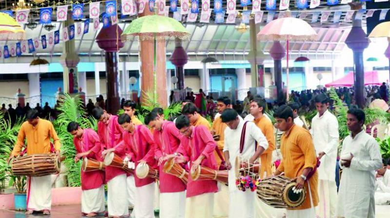 A bhajan troupe performs at Prasanthi Nilayam on Monday, as part of Thiruvonam celebrations.