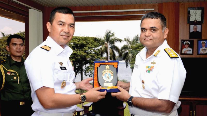 Commanding Officer of the visiting ship Captain Alan Dahlan presents a memento to Rear Admiral R.J. Nadkarni,  chief of staff, Southern Naval Command.	(Photo: DC)