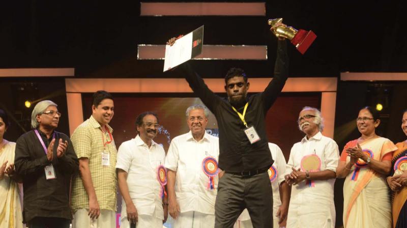 Actor Vinayakan along with Chief Minister Pinarayi Vijayan and others during 47th Kerala State Film Awards in Thalassery on Sunday.