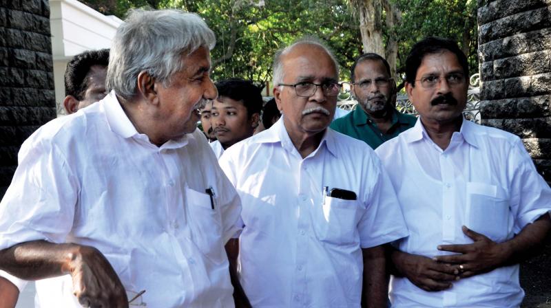 Former Chief Minister Oommen Chandy with the relatives of Fr. Uzhunnalil comes out of Raj Bhavan after meeting Governor seeking Uzhunnalils release. 	(File pic)