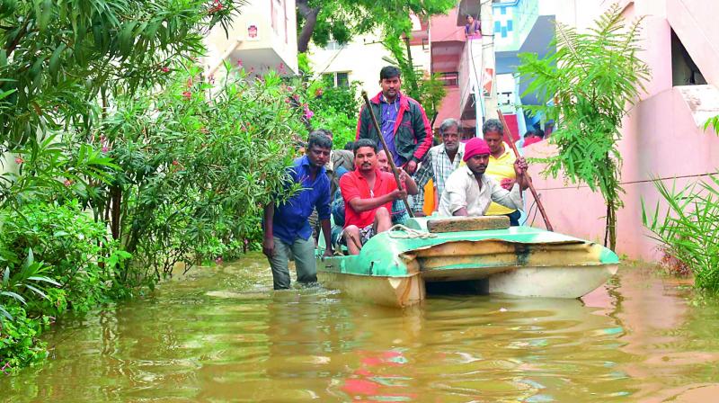 A motorboat travels through the submerged streets in East Anandbagh on Thursday. 	(Photo: DC)