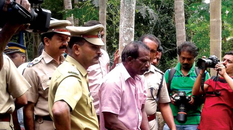 First accused in the double murder, Sadanandan of Paravur, brought to the scene of crime at Tholanur on Thursday to collect evidence.