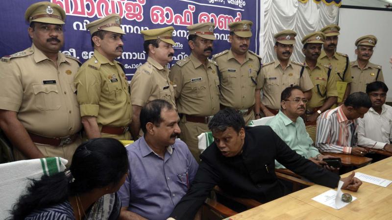 Badge of honour recepients pose with Vigilance SP Nishanthini, ADGP Sheik Darvesh Sahib, SPC Loknath Behera, former Vigilance director K.P. Somarajan and SP M.N. Vijayakumaran during the presentation ceremony at Vigilance HQ in Thiruvananthapuram on Friday. (Photo: Peethambaran Payyeri)