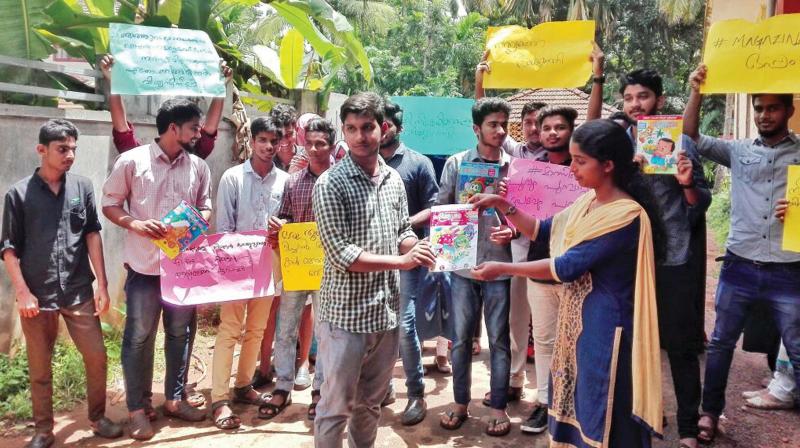 Students at Government Arts and Science College, Nadapuram distribute a childrens magazine in protest against the censorship. 	  Arrangement