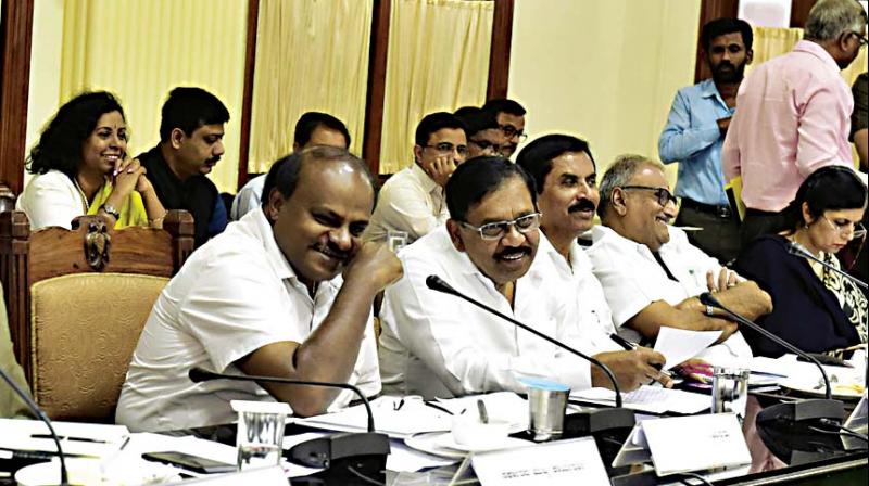 Chief Minister H.D. Kumaraswamy and Deputy Chief Minister Dr G. Parameshwar at a pre-budget meeting with farmer leaders at Vidhana Soudha in Bengaluru on Friday 	 KPN