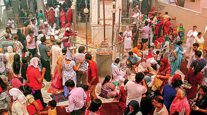 Kashmiri Pandits offer prayers at a replica of Kheer Bhawani temple on the occasion of the annual Kheer Bhawani Mela, in Jammu on Wednesday   (Image: PTI)