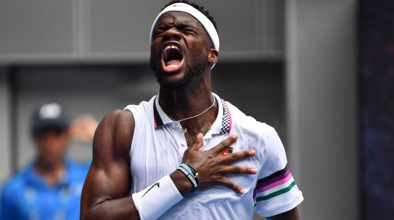 Frances Tiafoe rolled up his sleeve, flexed and slapped his biceps muscle five times to celebrate the biggest victory of his career. (Photo: AFP)