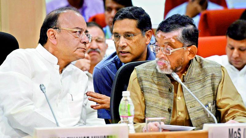 Union finance minister Arun Jaitley with MoS Santosh Gangwar and CEA Arvind Subramanian at the GST Council meeting in New Delhi on Sunday. (Photo: AP)