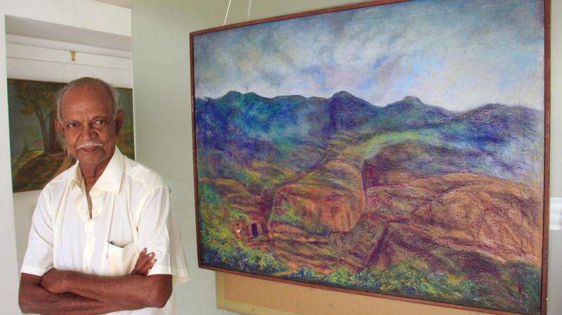 T. Sundarababu along with one of his paintings.