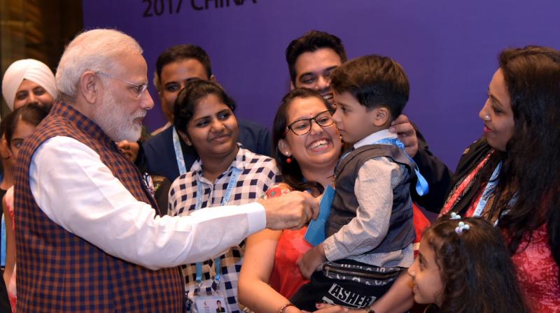 Prime Minister Narendra Modi being welcomed by the Indian community, on his arrival, to attend the 9th BRICS Summit, in Xiamen, China on Sunday. (Photo: PIB)