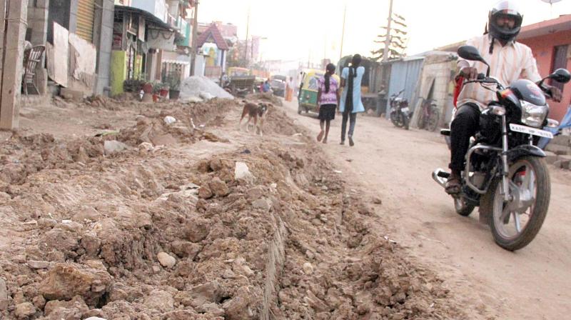 The main road at L.R. Nagar in Neelasandra has not been restored after the BWSSB laid a new water pipeline 	 DC