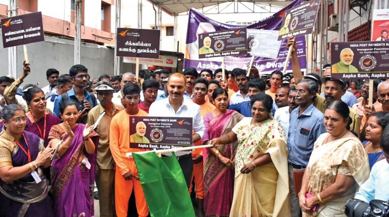 BJP state president Tamilisai Soundararajan flags off an awareness rally on the launch of India Post Payments bank organised by Central division post office at T Nagar, in Chennai on Wednesday.  (Photo:DC)