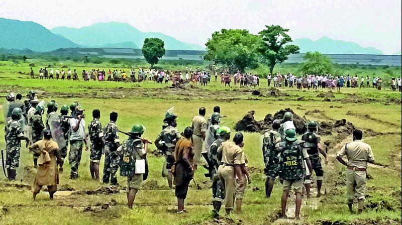 Police on their toes to keep a check on agitators protesting against Vamsadhara Reservoir in Srikakulam district on Wednesday. (Photo: DC)