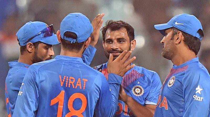Comeback man Mohammed Shami (3/47 in 8 overs) along with Bhuvneshwar Kumar (3/28 in 6.4 overs) shared bulk of the spoils to dismiss New Zealand for a meagre 189 in 38.4 overs. (Photo: PTI)