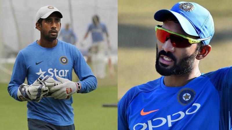 The All-India Senior Selection Committee has named Dinesh Karthik as the replacement for Wriddhiman Saha for the third and final Test against South Africa. He is set to join the team before the third Test,  said BCCI. (Photo: AP / PTI)