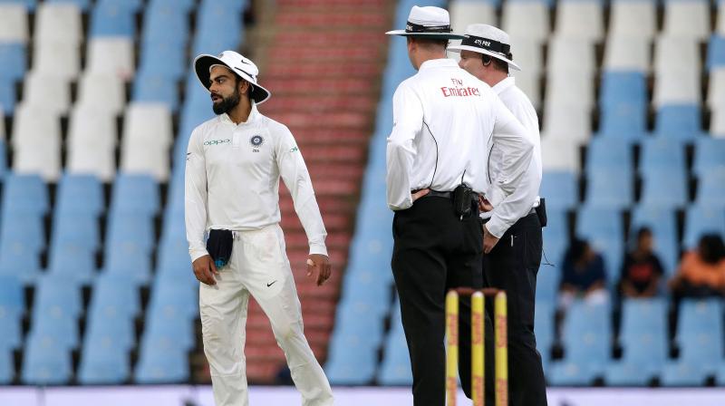Mondays incident happened in the 25th over of South Africas second innings when Kohli continued to complain to umpire Michael Gough about the ball being affected by a damp outfield following a rain delay, before throwing the ball into the ground in an aggressive manner,  said ICC in its media release. (Photo: AFP)