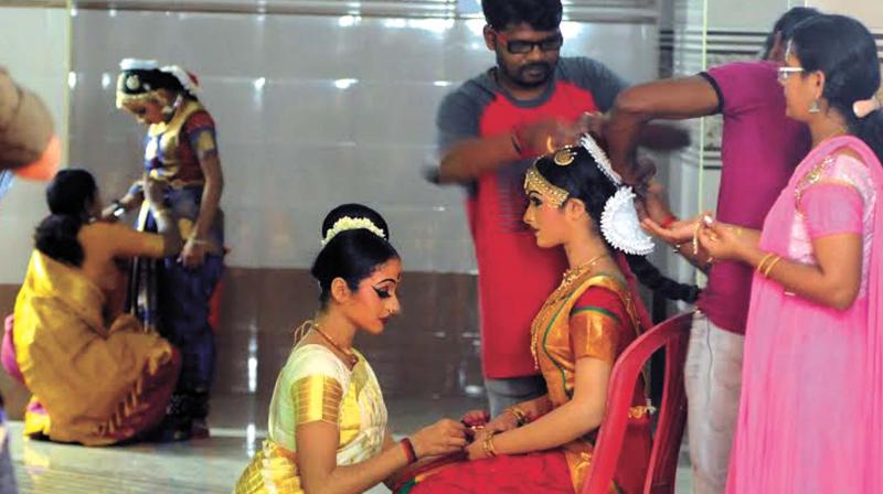 Participants of Bharatanatyam competition engrossed in last minute preparation.	(Photo: DC)