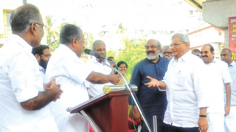 CPM general secretary Sitaram Yechury greets Chief Minister Pinarayi Vijayan and other ministers at the satyagraha venue in front of RBI regional headquarters to protest against the alleged BJP conspiracy to destroy cooperative sector in Thiruvananthapuram on Friday (Photo:  A.V. MUZAFAR)