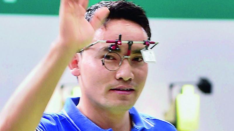 Jitu Rai celebrates his bronze in the mens 10m air pistol final of the ISSF World Cup in New Delhi (Photo: AP)