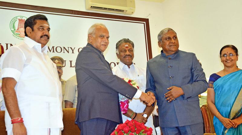 Governor Banwarilal Purohit greets retired IAS officer S.Ayyar after he was sworn in Tamil Nadu local bodies ombudsman at Raj Bhavan on Monday. Chief Minister Edappadi K. Palaniswami, Deputy Chief Minister O. Panneerselvam and Chief Secretary Girija Vaidyanathan also seen. (Photo: DC)