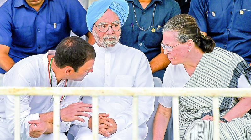 Former Congress president Sonia Gandhi, former Prime Minister Manmohan Singh (C) and Congress President Rahul Gandhi (L) during Bharat Bandh protest.	PTI called by Congress and other parties against fuel price hike and depreciation of the rupee, in New Delhi, Monday, Sept 10, 2018. (PTI Photo)