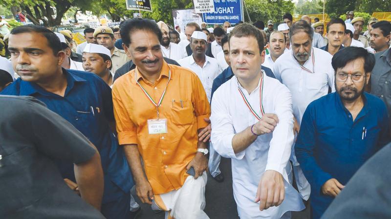 Congress President Rahul Gandhi with other leaders takes part in a protest march in New Delhi on Monday 	PTI