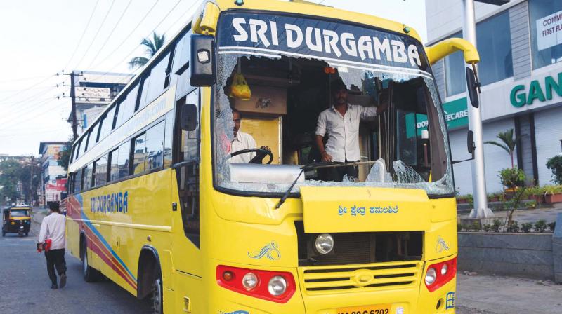 A bus damaged during Bharat Bandh in Mangaluru on Monday.