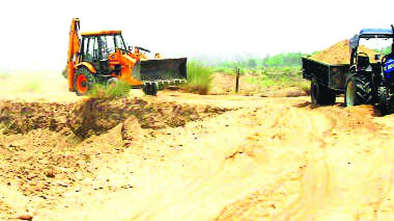 The MLA is demanding 60 acres of land as part of the amicable settlement to allow lifting of the sand from patta lands.