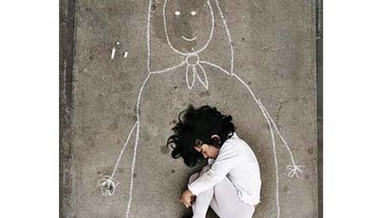 The portrait the judges reproduced in their humane order. It shows an Iraqi girl in an orphanage  missing her mother; so she drew her and fell asleep inside her.