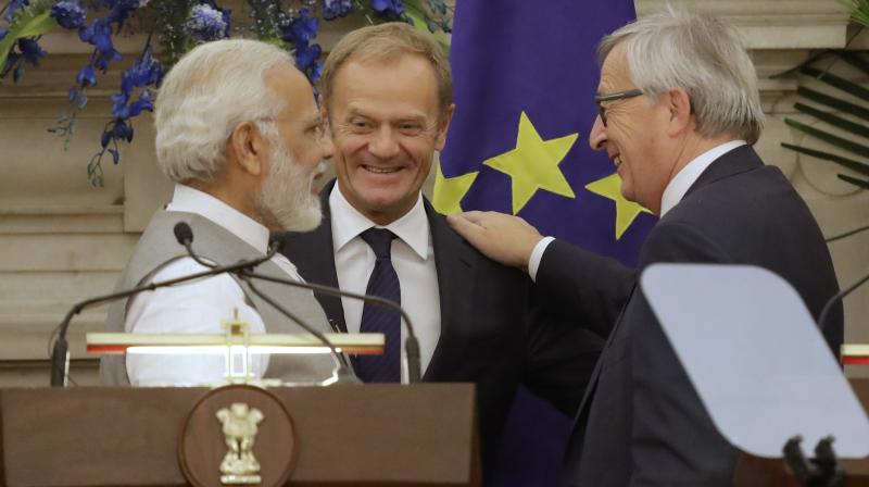 European Council President Donald Franciszek Tusk and European Commission President Jean-Claude Juncker talked about the much-delayed trade pact between the two sides at a joint press event with Prime Minister Narendra Modi. (Photo: AP)