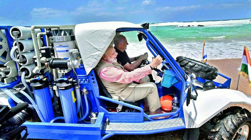 Prime Minister Narendra Modi with his Israeli counterpart Benjamin Netanyahu at Olga Beach in Israel. (Photo: PTI)