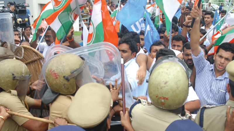 Youth Congress activists engaged in a scuffle with police during the protest march taken out to AMMA president Innocents house at Irinjalakuda on Thursday. (Photo:  Anup K. Venu)