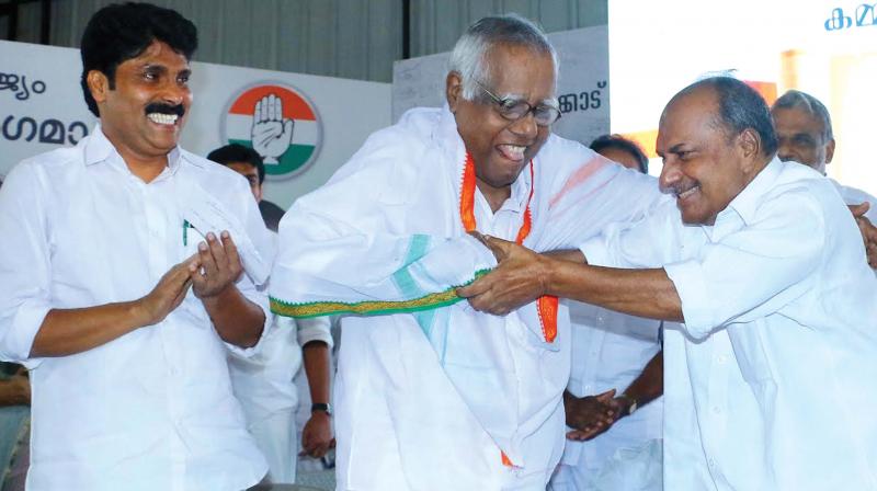 Senior Congress leader A.K. Antony honours former minister Cyriac John at DCC office in Kozhikode on Monday . The prgramme was organised as part of the 100th anniversary of the first Malabar Congress committee conference, called Charithra Smruthi. DCC president T. Siddique is also seen. (Photo: DC)